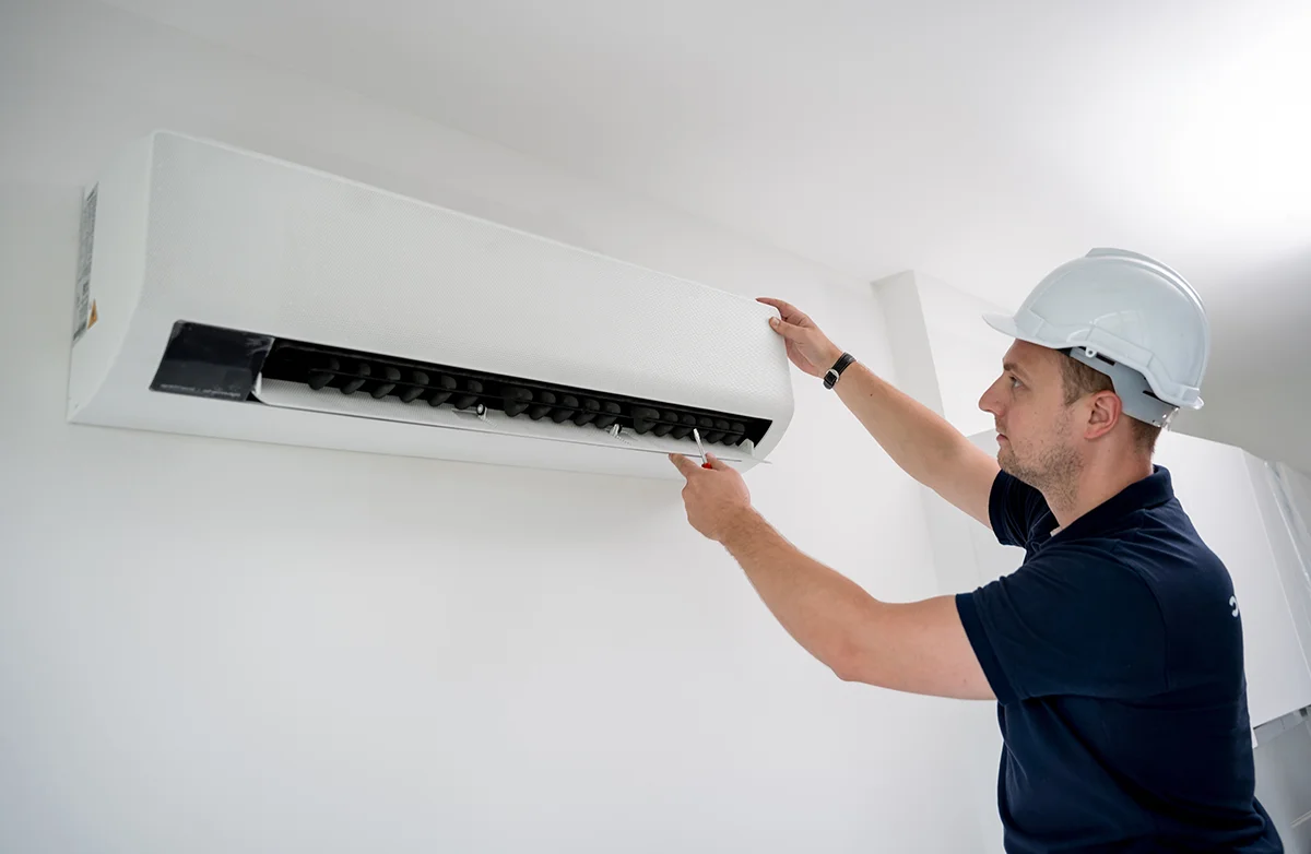 technician-cleans-air-conditioner-system